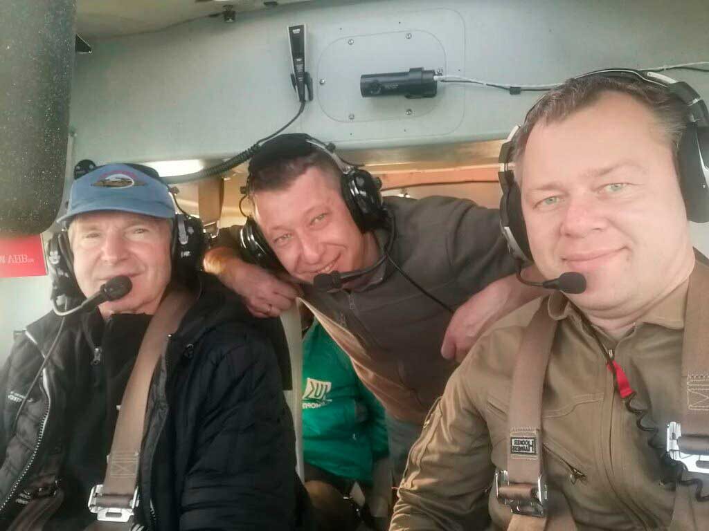 The crew of the expedition amphibious aircraft (from left to right): Valery I. Tokarev, Chief Pilot of the expedition; Alexei Krasnov, Flight Engineer; A.D. Ivanov, Co-pilot. 